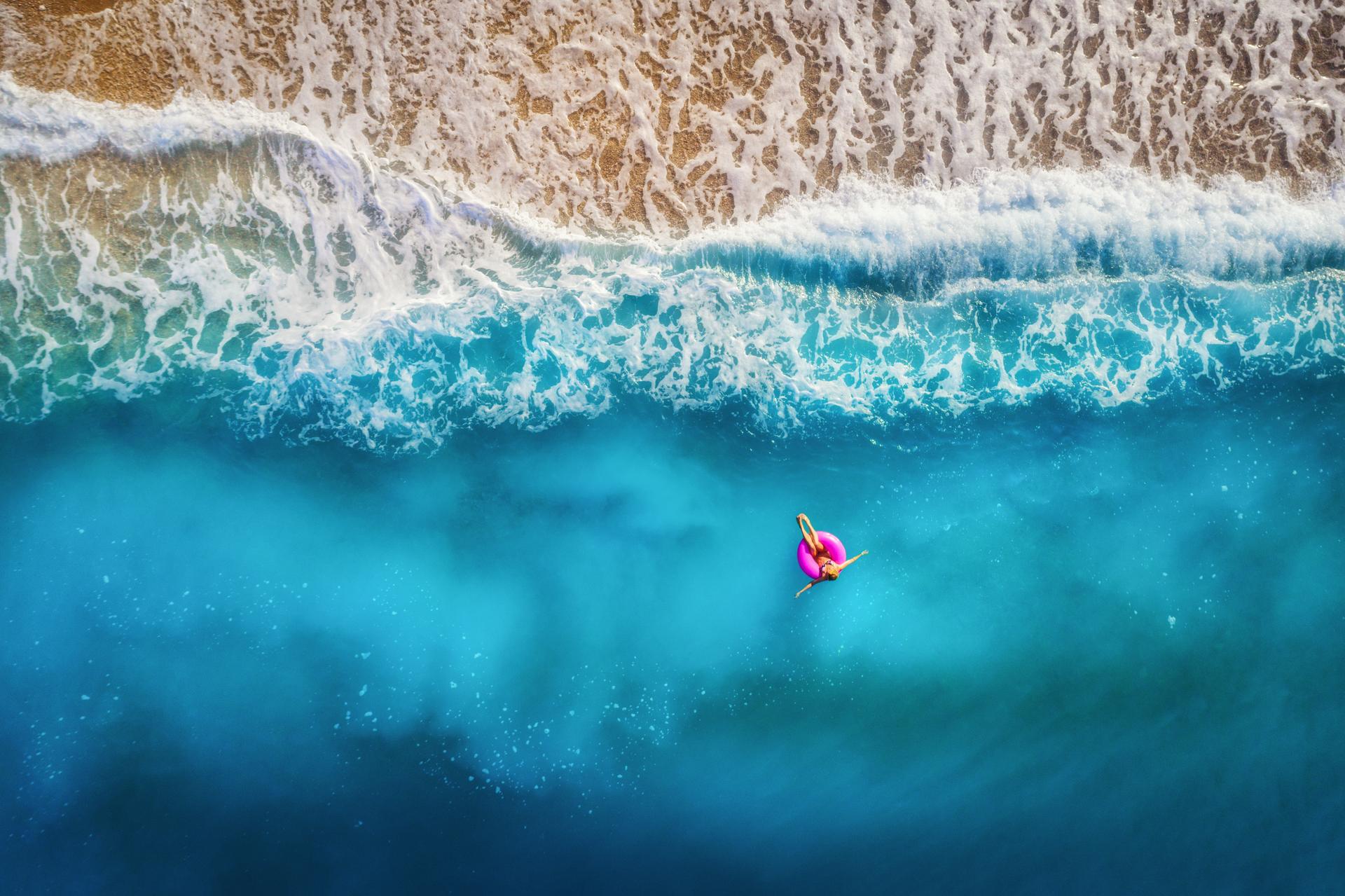 Aerial view of the ocean meeting the shore